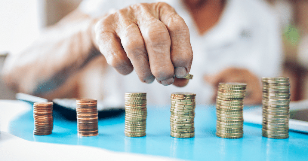 Man counting stacks of coins