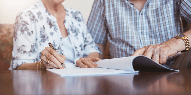 Inheritance tax couple signing document